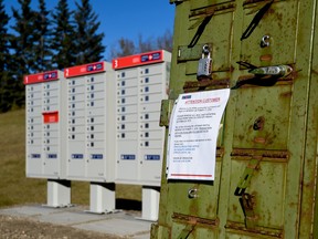A letter pinned to the old mailboxes informing Parkland County residents that their mailbox has been moved to a new location on Friday, Oct. 21, 2016 - Yasmin Mayne.