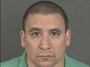 This undated photo provided by the Denver Police Department shows Julian Archuleta. Authorities say a Denver police officer's body camera captured him stealing $1,200 from a suspect at a crime scene. A police report released Friday, oct. 28, 2016, says 48-year-old Archuleta can be seen in the footage taking cash from the suspect's clothing during a shooting investigation. (Denver Police Department via AP)