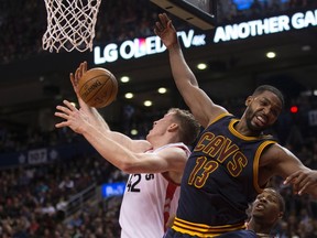 Toronto Raptors centre Jakob Poeltl (left) battles for the ball against Cleveland Cavaliers centre Tristan Thompson during second half NBA basketball action in Toronto on Oct. 28, 2016. (CHRIS YOUNG/The Canadian Press)