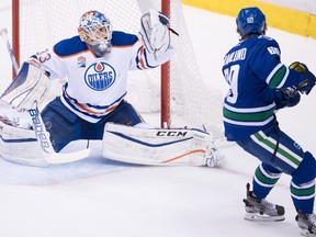 Edmonton Oilers' goalie Cam Talbot, left, stops Vancouver Canucks' Markus Granlund, of Finland, during the second period of an NHL hockey game in Vancouver, B.C., on Friday October 28, 2016.