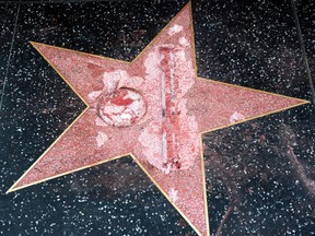 The vandalized star for Republican presidential candidate Donald Trump is seen on the Hollywood Walk of Fame, Wednesday, Oct. 26, 2016, in Los Angeles. (AP Photo/Richard Vogel)