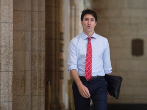 Canadian Prime Minister Justin Trudeau makes his way to caucus on Parliament Hill in Ottawa, Wednesday October 26, 2016. (THE CANADIAN PRESS/Adrian Wyld)