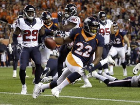 Denver Broncos running back C.J. Anderson (22) scores a touchdown against the Houston Texans during the first half of an NFL football game in Denver. Anderson tweeted early Friday, Oct. 28, 2016, that his knee surgery was a "super success" and he was in "great spirits" but he added there was still "no timetable" for his possible return to the Broncos lineup. (AP Photo/Jack Dempsey, File)
