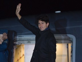 Canadian Prime Minister Justin Trudeau boards a government plane in Ottawa, Saturday October 29, 2016. The plane was forced to land shortly after takeoff. (THE CANADIAN PRESS/Adrian Wyld)