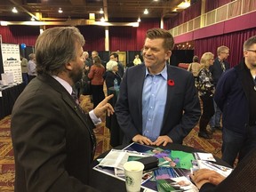 Wildrose Leader Brian Jean speaks with a supporter at the party's AGM in Red Deer Saturday, Oct. 29, 2016. (Emma Graney / Postmedia)