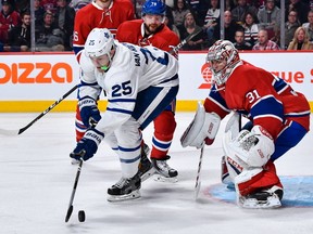 James van Riemsdyk of the Toronto Maple Leafs tries to get a shot on goaltender Carey Price of the Montreal Canadiens during the NHL game at the Bell Centre on October 29, 2016 in Montreal, Quebec, Canada. (Minas Panagiotakis/Getty Images)