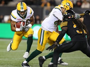 Edmonton Eskimos running back John White (30) runs for some yards during the first-half of CFL football action against the Hamilton Tiger-Cats in Hamilton on Friday, October 28, 2016.