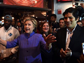 U.S. Democratic presidential nominee Hillary Clinton speaks to supporters at a pub in Miami, Fla., on Oct. 30, 2016. (JEWEL SAMAD/AFP/Getty Images)