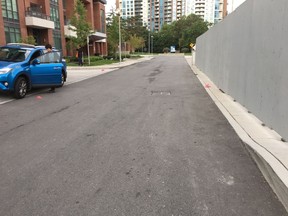 Someone threw pink bags of excrement in this condo laneway in North York. (VICTOR TRAN PHOTO)