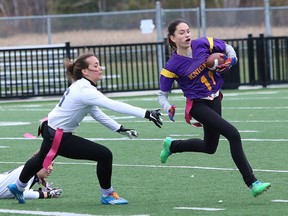 Sammi Whitehead, right, of Lo-Ellen Knights, eludes a Marymount Regals defender during girls high school flag football semifinal action at James Jerome Sports Complex in Sudbury, Ont. on Friday October 28, 2016. Marymount won 13-1 and will face the Confederation Chargers in Tuesday's city final. John Lappa/Sudbury Star/Postmedia Network