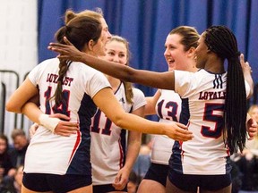 Loyalist women's volleyball players celebrate a point during their weekend win over Georgian. (Loyalist Lancers Athletics)