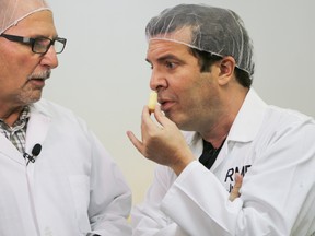 Comedian and political satirist Rick Mercer, seen here with judge Barry Reid, stopped by the The British Empire Cheese Competition to film a segment for his CBC show, The Rick Mercer Report, on Sunday October 30, 2016 in Belleville, Ont. Mercer brought a wheel of cheese with him for the judges to try that he had helped make at Mountainoak Cheese in New Hamburg, Ont. the day before. Tim Miller/Belleville Intelligencer/Postmedia Network