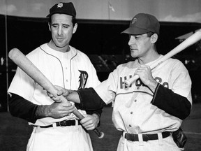 In this Oct. 4, 1945, file photo, Detroit Tigers leftfielder Hank Greenberg, left, and Chicago Cubs first baseman Phil Cavaretta, right, talk before Game 2 of baseball's World Series in Detroit. (AP Photo/File)