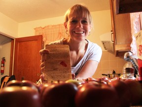Patty Knott holds her well-worn recipe for candy apples, one that's been used by her family at Halloween for the last 50 years. She and her sister make hundreds of candy apples for family, friends, and trick-or-treaters who are on their lists. (Tyler Kula/Sarnia Observer)