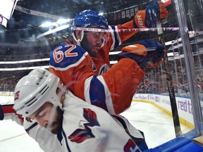 Edmonton Oilers defenceman Eric Gryba checks Washington Capitals’ Daniel Winnik earlier this month. An ex-Senator, Gryba faced his old team last night at Rogers Place Arena. (Ed Kaiser/Postmedia Network file)