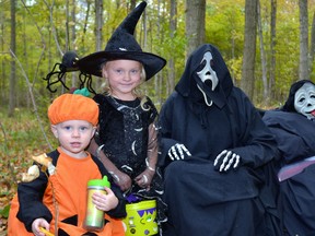 Darius and Dakota Davidson weren't quite sure why their parents made them pose for a picture with Scream (Dianne Oliver) and her odd friend, but they went along with it anyway clearly for the candy, during the Optimist Club Spooktacular event last Saturday, Oct. 29 at the Vorstenbosch bush outside Mitchell. The second day last Sunday, Oct. 30 was a little more damp but no less fun! GALEN SIMMONS MITCHELL ADVOCATE