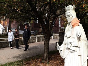 A decapitated statue of baby Jesus outside a Catholic church in Sudbury will remain headless this Christmas, as the church says it will be months before the head can be reattached. People walk pass a statue of the Virgin Mary holding baby Jesus outside the Ste. Anne des Pins parish in Sudbury, in an October 20, 2016, file photo. THE CANADIAN PRESS/Gino Donato