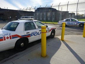 Police cars congregate at London's Elgin Middlesex Detention Centre Monday morning, where one inmate died from a drug overdose and another is in hospital. (Morris Lamont/The London Free Press)