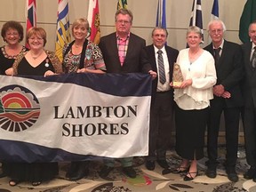 The Municipality of Lambton Shores won Communities in Bloom's (CiB) international challenge large category, an outstanding achievement award for tidiness and special mention in the CiB's mystery tour. From left are Lambton Shores Mayor Bill Weber, Ginger Weber, CiB judge Odette Sabourin-Dumais, committee members Grace Dekker, Jim Dekker, Jim Minielly and Catherine Minielly, judge Piet Boersma and national CiB chairperson Bob Lewis. (Handout/Sarnia Observer/Postmedia Network)