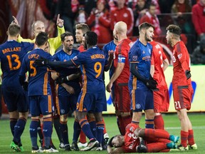 TFC's Armando Cooper fouled by New York City FC forward David Villa during MLS playoff action in Toronto on Oct. 30, 2016. (Craig Robertson/Toronto Sun/Postmedia Network)