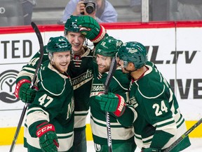Minnesota Wild center Tyler Graovac celebrates his first NHL goal with teammates during an NHL game against the Dallas Stars on Oct. 29, 2016, in St. Paul, Minn. (AP Photo/Paul Battaglia)