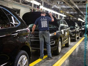 Ford Edges sit on a production line as Ford Motor Company celebrates the global production start of the 2015 Ford Edge at the Ford Assembly Plant in Oakville, Ont., on Thursday, February 26, 2015. (THE CANADIAN PRESS/Chris Young)