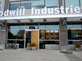 Boards replace one of nine windows and a door shattered in a vandalism spree at Goodwill Industries on Horton Street in London. (MORRIS LAMONT, The London Free Press)