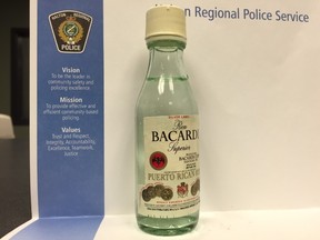 Photograph of a mini bottle containing a mystery liquid found in Halloween candy in Milton (Halton Regional Police handout)