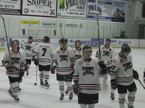 The Whitecourt Wolverines celebrate after a 4-1 victory versus the Olds Grizzlies on Oct. 28. The Wolverines won both their home games on the weekend and have won seven of their past eight, putting them near the top of AJHL standings.