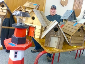 The Point Clark Community Centre saw 29 vendors and about 175 people out for the Huron Lakeshore Friendship Club Christmas Craft Show on Oct. 29, 2016. Pictured: 'The Bird Man' Roy Douglas of Point Clark, shows off the birdhouses he makes from barn boards, branches, and other materials that he has been shipping abroad this year. (Troy Patterson/Kincardine News and Lucknow Sentinel)