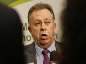 Michael Gravelle, minister of Northern Development and Mines, takes part in a press conference at the Mining Innovation Summit in Sudbury, Ont. on Tuesday November 1, 2016. John Lappa/Sudbury Star/Postmedia Network