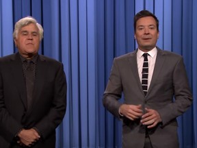 Jay Leno paid a late night visit to Jimmy Fallon on Monday and tagged-in during the show's monologue. (YouTube screengrab)