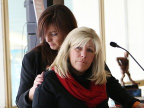 Patricia Hynes-Coates, left, MADD Canada national president, and Kim Hancock are overcome with emotion during the launch of MADD Canada's national holiday awareness campaign, Project Red Ribbon, in Sudbury, Ont. on Tuesday November 1, 2016. John Lappa/Sudbury Star/Postmedia Network