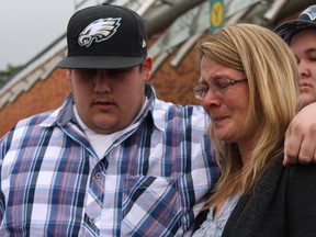 Geoff Gaston's widow, Tanya, leaves court with their two sons, Josh and Tim. (TRACY MCLAUGHLIN PHOTO)