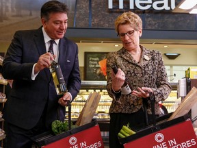 Ontario Premier Kathleen Wynne along with Finance Minister Charles Sousa give an update on wine being sold in grocery stores across Ont. at the Longo's on Laird Dr. in Toronto, Ont. on Thursday February 18, 2016. Dave Thomas/Toronto Sun/Postmedia Network