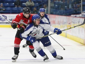 Ethan Szypula, left, of the Owen Sound Attack, and Kyle Capobianco, of the Sudbury Wolves, battle for the puck during OHL action at the Sudbury Community Arena in Sudbury, Ont. on Friday October 7, 2016. Capobianco signed his first NHL contract last weekend. John Lappa/Sudbury Star/Postmedia Network
