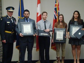 Photo supplied
Receiving lifesaving awards from OPP Commissioner Vince Hawkes on Friday in North Bay are Scott Thomas, Nicholas Vaillancourt, Kyra Ranney and Jasmina Omri. The four helped save the life of a camper at YMCA John Island Camp in 2015.