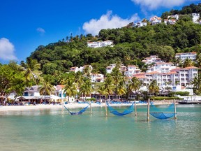 With its clear waters and lush hillsides, Labrelotte Bay is one of the most scenic spots on St. Lucia.