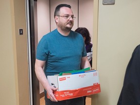 Jean-Claude Savoie arrives at court in Campbellton, N.B., on Tuesday, Nov. 1, 2016. Savoie is charged with criminal negligence causing death after two young brothers, Connor and Noah Barthe, were asphyxiated by an African rock python in August 2013. (THE CANADIAN PRESS/Andrew Vaughan)