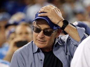 Charlie Sheen reacts during Game 4 of the National League Championship Series between the Chicago Cubs and the Los Angeles Dodgers Wednesday, Oct. 19, 2016, in Los Angeles. (AP Photo/David J. Phillip)