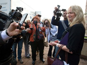 Andrea Silcox, 54, youngest daughter of James Silcox, 84, holds onto her dad's Bible at the court appearance of Elizabeth Wettlaufer. (CRAIG GLOVER, The London Free Press)