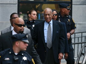 Bill Cosby, center, leaves after a hearing in his sexual assault case at the Montgomery County Courthouse Tuesday, Nov. 1, 2016, in Norristown, Pa. Cosby's lawyers pressed a judge Tuesday to keep the comedian's damaging deposition in a decade-old lawsuit out of his sexual assault trial, saying Cosby agreed to answer questions under oath after being assured he wouldn't be charged with a crime. (AP Photo/Mel Evans)