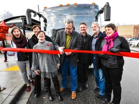Board members of the Bow Valley Regional Transit Services Commission with Roam Transit CAO Martin Bean (third from right) and Canmore Mayor John Borrowman (second from right) at the official ribbon-cutting ceremony of Canmore's local public transit service route in Canmore, Alta., on Tuesday, Nov. 1, 2016. BVRTSC Chair Sean Krausert cut the ribbon. (Daniel Katz/ Crag & Canyon/ Postmedia)