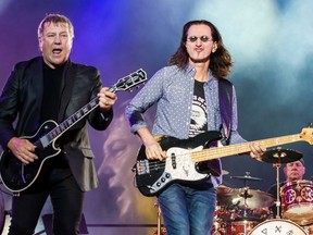 Alex Lifeson, Geddy Lee and Neil Peart of Rush performing at RBC Bluesfest in Ottawa. July 8, 2013. Errol McGihon, Postmedia Network