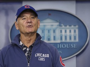 Bill Murray sporting a Chicago Cubs jacket and cap talks during a brief visit in the Brady Press Briefing Room of the White House in Washington. (AP Photo/Manuel Balce Ceneta, File)