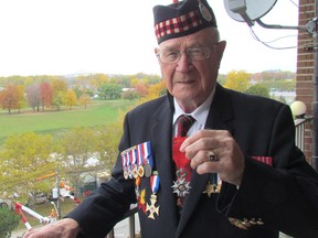 Sarnia's Roy Hare holds the National Order of the Legion of Honour medal he received from the government of France, in recognition of his service in the Canadian Army during the Second World War. Hare received the medal earlier this year during a ceremony in Windsor.
 Paul Morden/Sarnia Observer/Postmedia Network