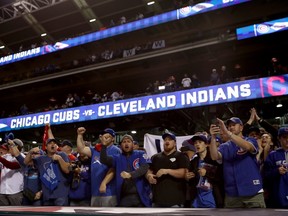 Chicago Cubs fans cheer after the Cubs defeated the Cleveland Indians 9-3 to win Game Six of the 2016 World Series at Progressive Field on November 1, 2016 in Cleveland, Ohio. (Elsa/Getty Images)