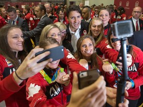 Prime Minister Justin Trudeau and Canadian Olympians in Ottawa on Nov. 2. (Wayne Cuddington, Postmedia Network)