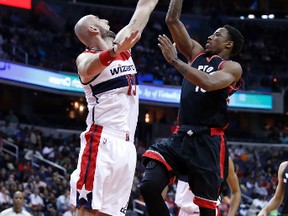 Toronto Raptors guard DeMar DeRozan shoots over Washington Wizards centre Marcin Gortat during the first half of an NBA game on Nov. 2, 2016 in Washington. (AP Photo/Alex Brandon)