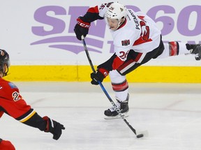 Senators' Matt Puempel lets a shot go against Dougie Hamilton of the Flames during NHL action in Calgary on Oct. 28, 2016. (Al Charest/Postmedia Network)